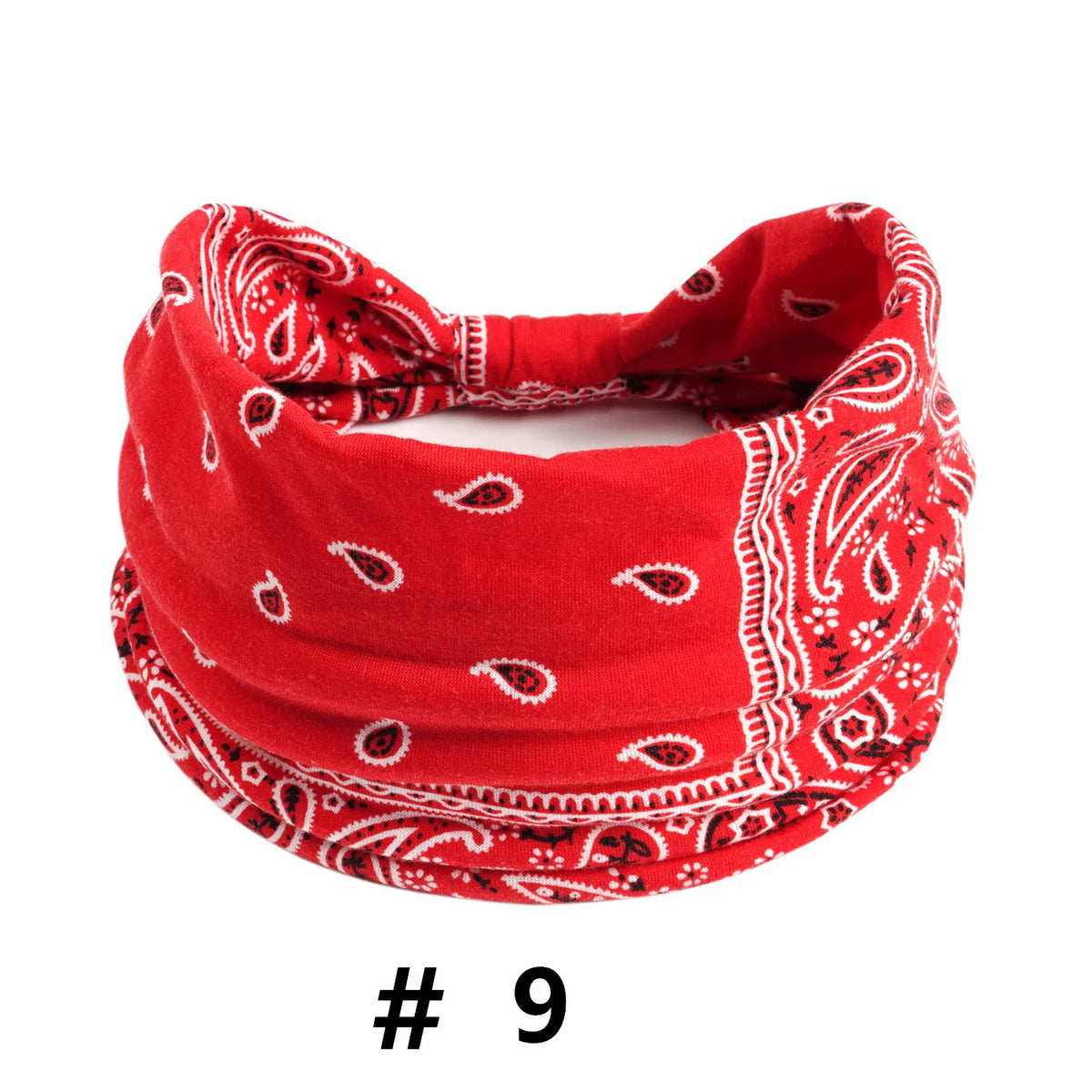 A red boho print cotton headband with white embroidery.