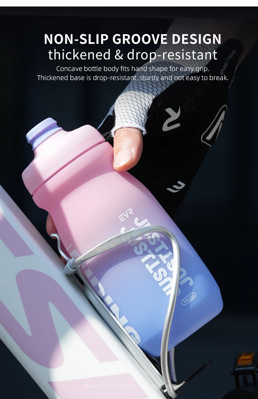 A hand holds a pink squeezable cycling water bottle with a non-slip groove design.