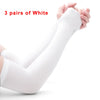 Three pairs of white protective arm sleeves being held by hands.