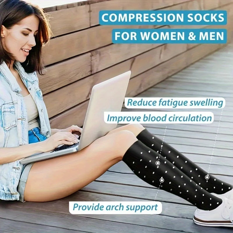 A woman is shown wearing black compression socks while using a laptop, demonstrating the product's benefits.