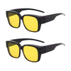 A pair of oversized black sunglasses with yellow lenses shown against a white background.