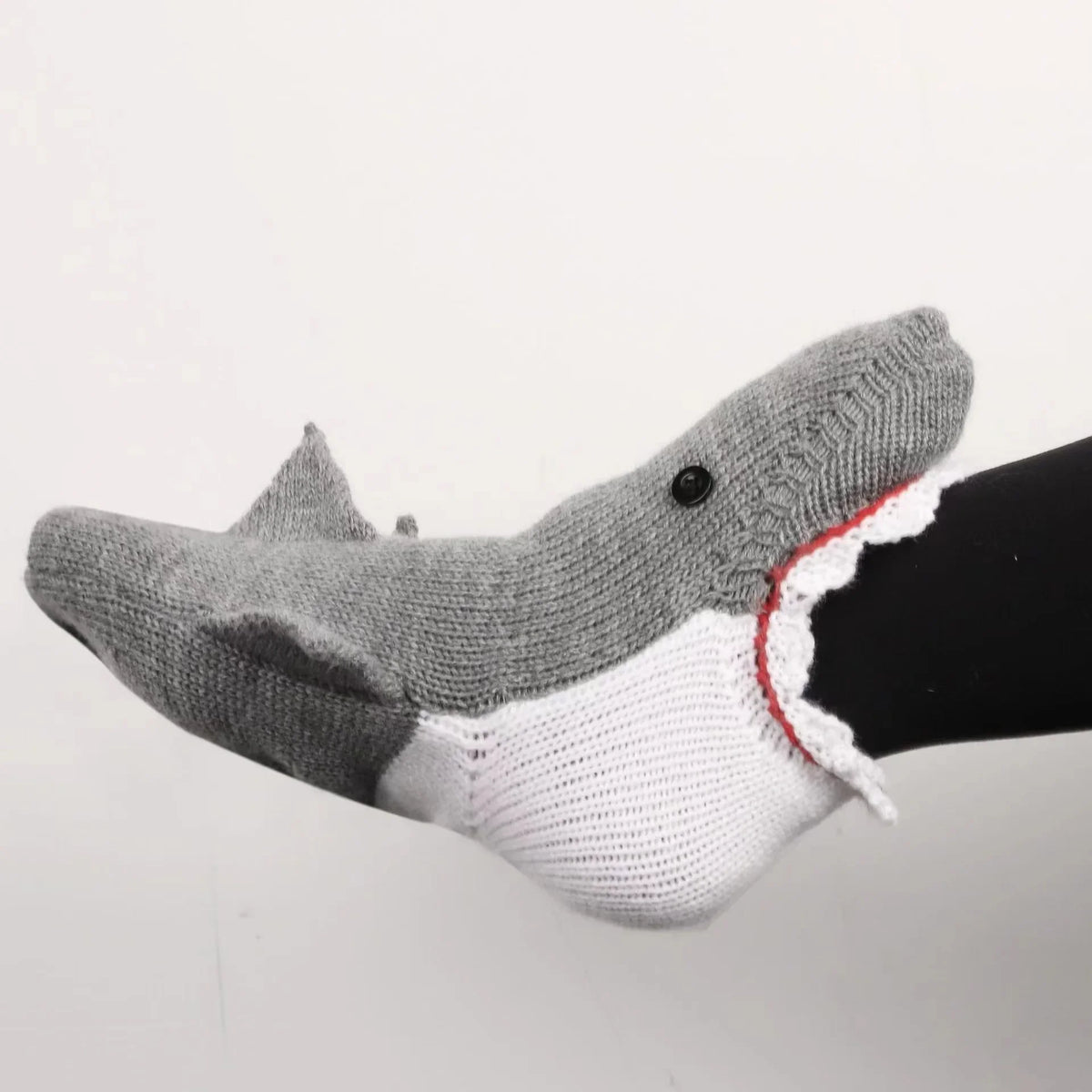 Gray crocodile knit socks featuring a realistic design and white trim