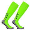 A pair of neon lime green professional training football socks with black dotted accents.