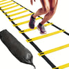 A person is running through a yellow agility ladder for sports training exercise.