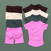 A collection of seamless yoga wear including short sleeve tops and workout leggings in various colors like black, white, gray