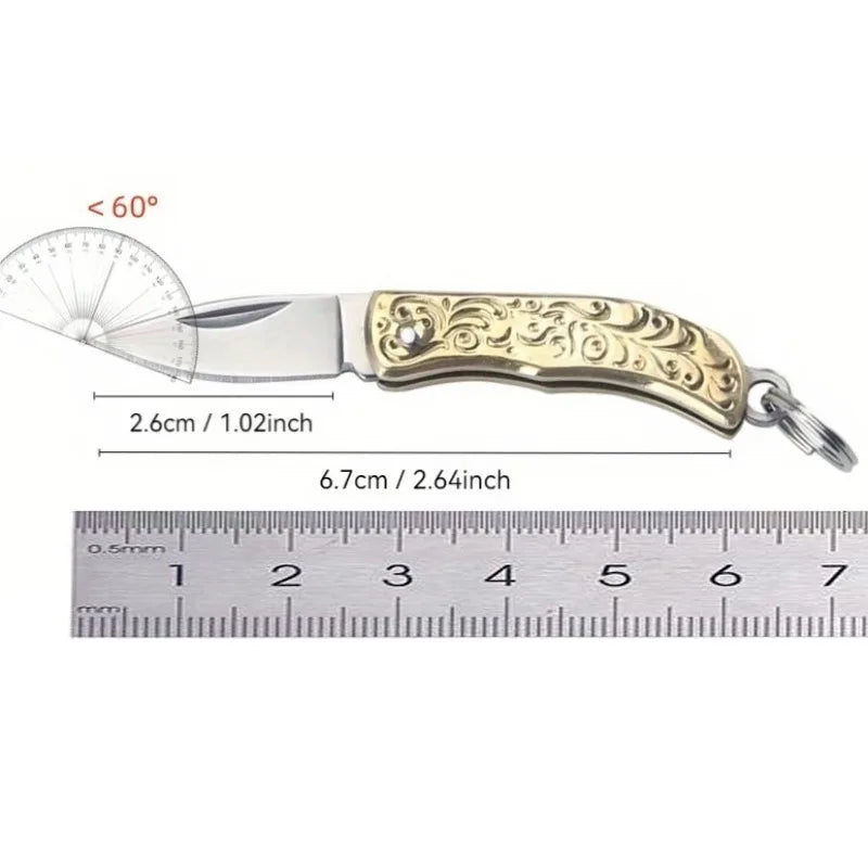 A brass folding knife with a silver blade and gold handle is shown next to a ruler, indicating a maximum angle of 60 degrees.