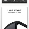 A close-up view of black polarized driving sunglasses with a flexible frame and arm.