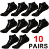 Ten pairs of black and gray color-block mesh ankle socks displayed on a white background.
