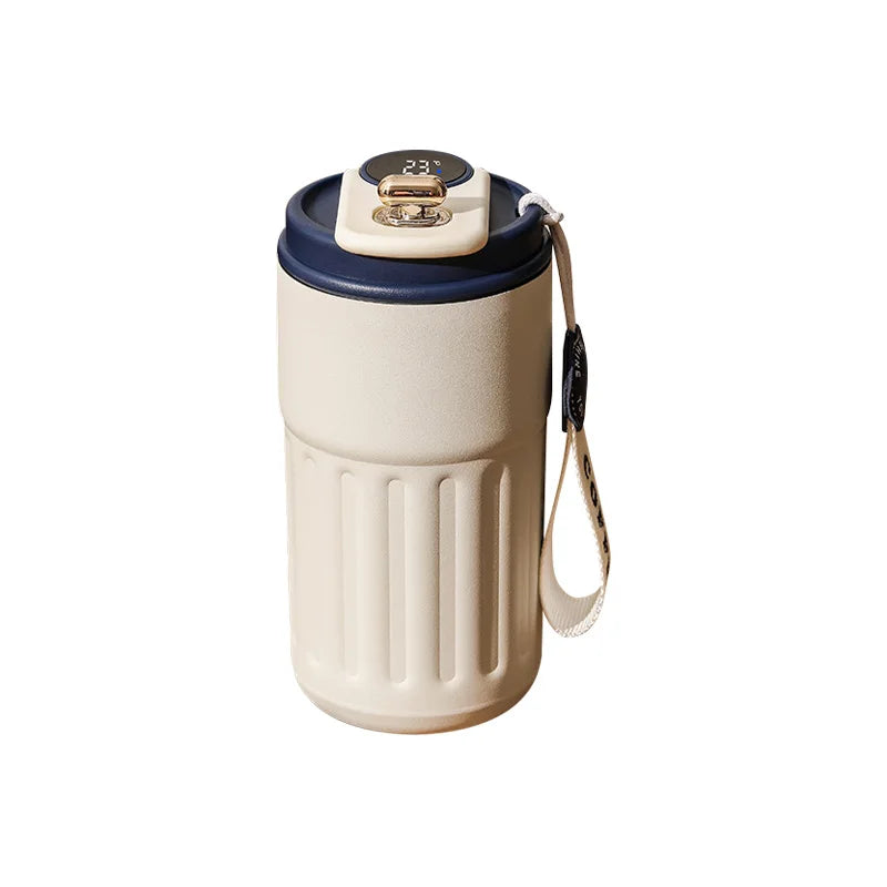 A beige insulated thermos bottle with a dark blue lid and a temperature display.