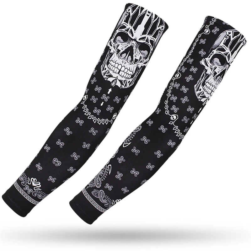 A pair of black arm sleeves featuring a skull design and intricate patterns for sports and UV protection.