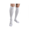A pair of white compression socks worn on a person's lower legs and feet.