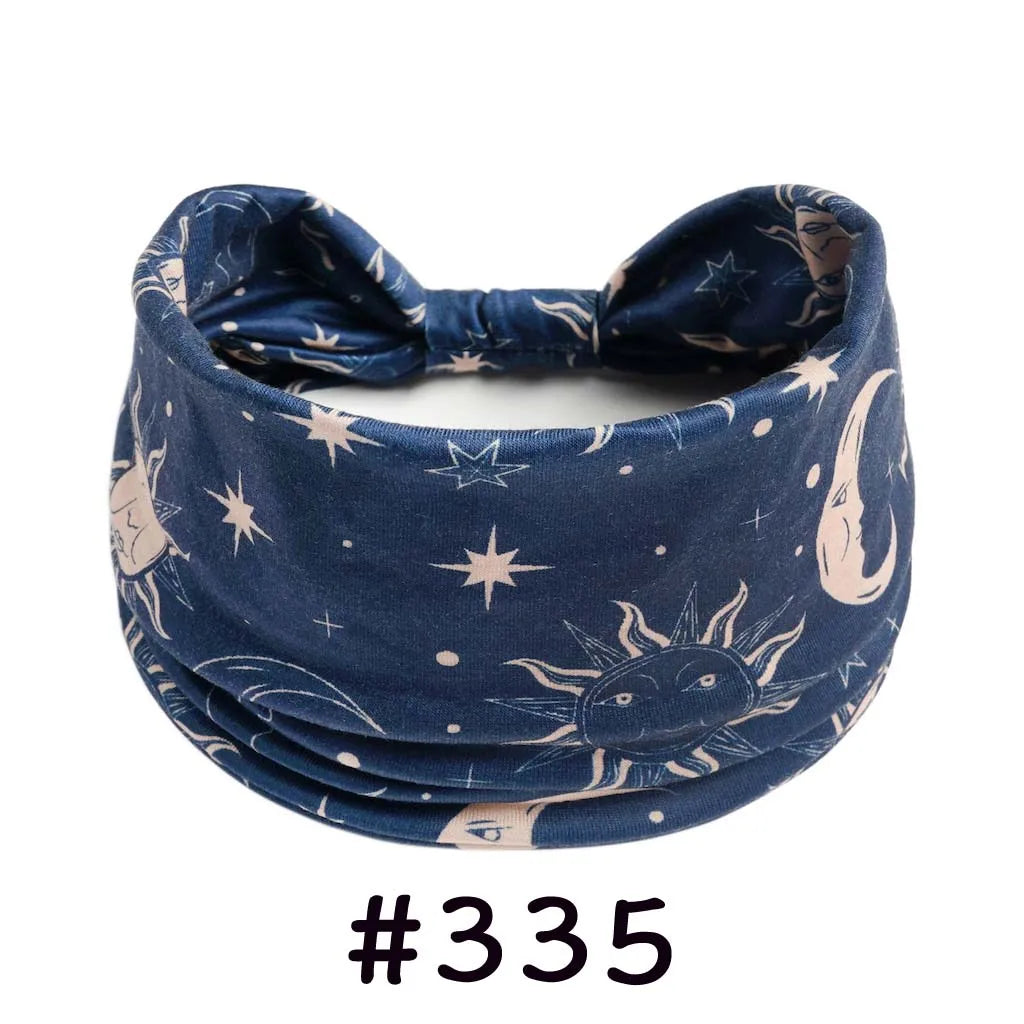 Navy blue boho knotted cotton headband featuring a crescent moon and star print