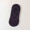 A dark purple non-slip yoga and gym sock with a silicone grip pattern.