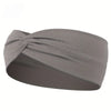 A gray knotted elastic sports headband is shown from the side.