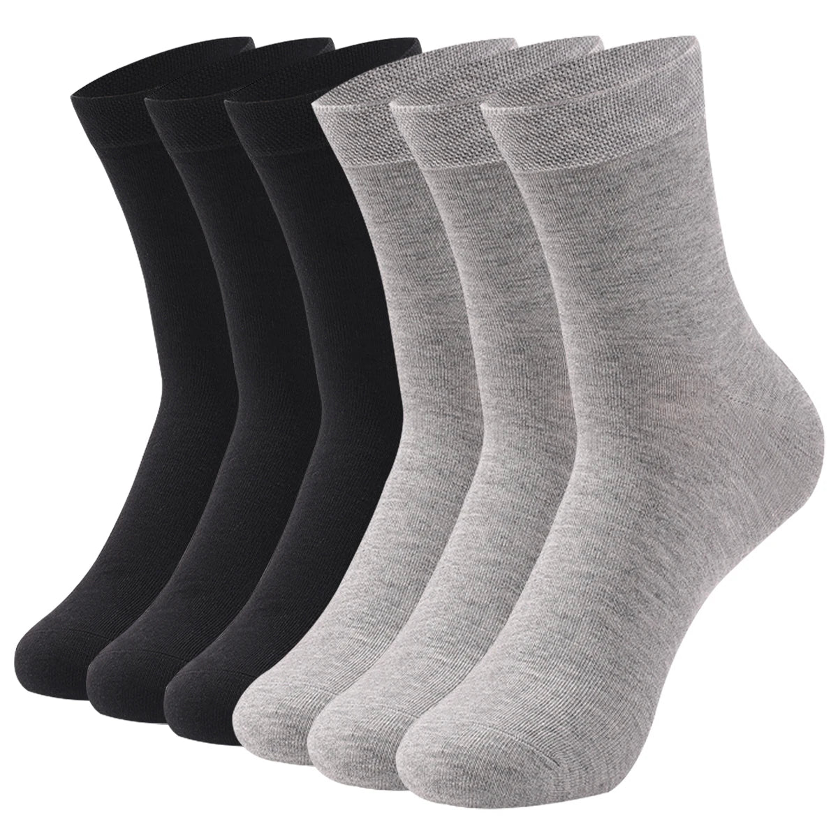 Une pile de chaussettes de coton premium, blanches et noires, vue de côté.