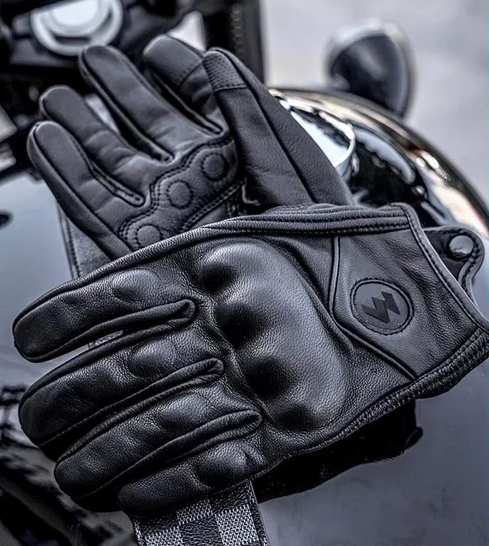 Black full finger leather motorcycle riding gloves shown in a close-up view.