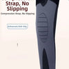 A hand is demonstrating a black compression strap on a gray knee sleeve, highlighting its anti-slip feature.