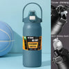 A tall, matte blue insulated water bottle with a silver straw drinking mechanism is shown next to a blue exercise ball.