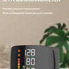 A black wrist rechargeable sphygmomanometer displaying blood pressure readings and a pulse rate.