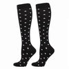 Black compression elastic socks with a white star pattern