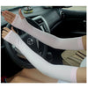 A person is wearing a long, light pink breathable arm sleeve while sitting in a car.