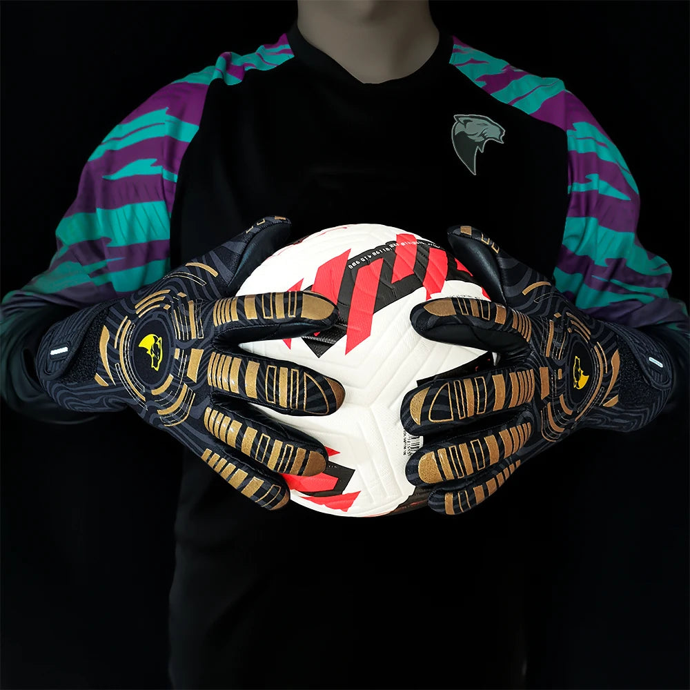 A person wearing a black shirt and purple sleeves holds a white and red patterned goalkeeper glove.