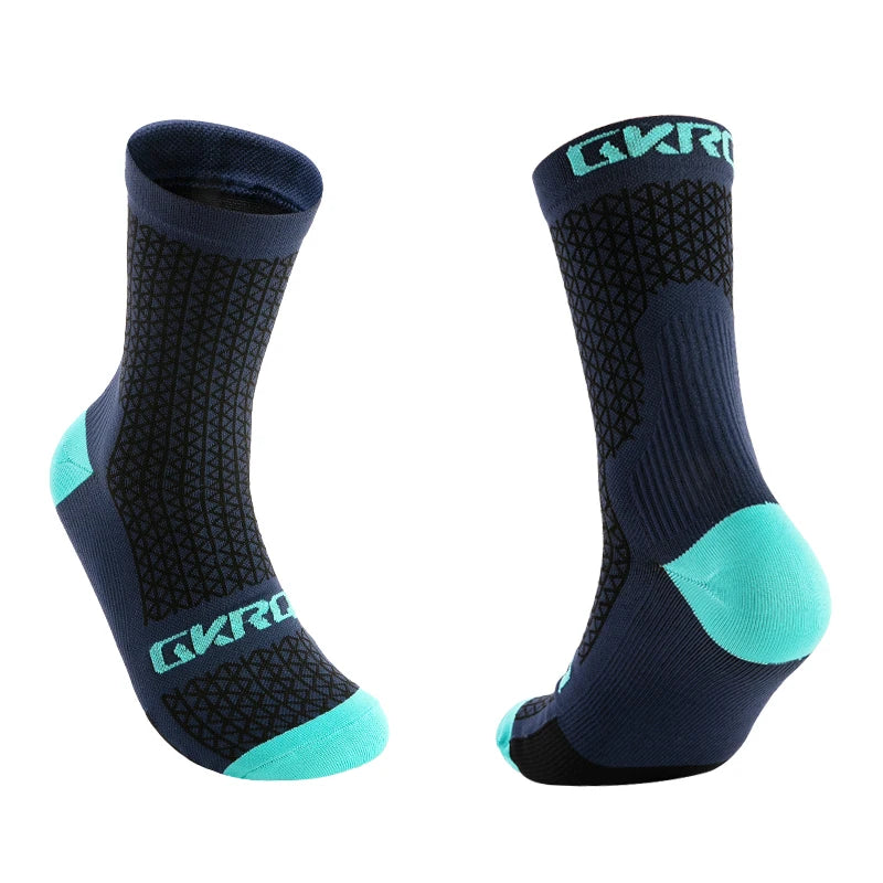 A pair of dark blue cycling socks with bright turquoise accents, shown in a side view.
