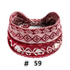 A stack of red and white patterned boho polka dot knitted headbands for yoga and workout.