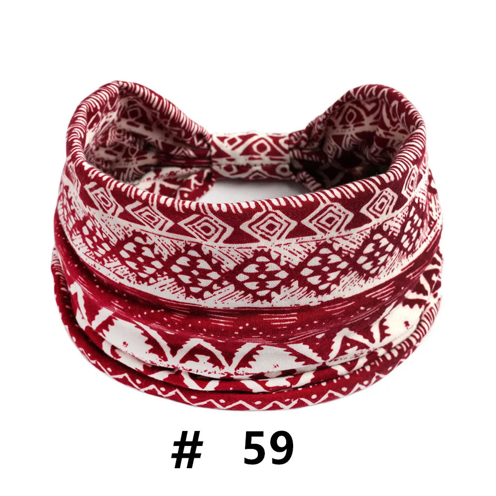 A stack of red and white patterned boho polka dot knitted headbands for yoga and workout.