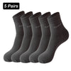 Five pairs of dark gray bamboo fiber socks laid out for display.