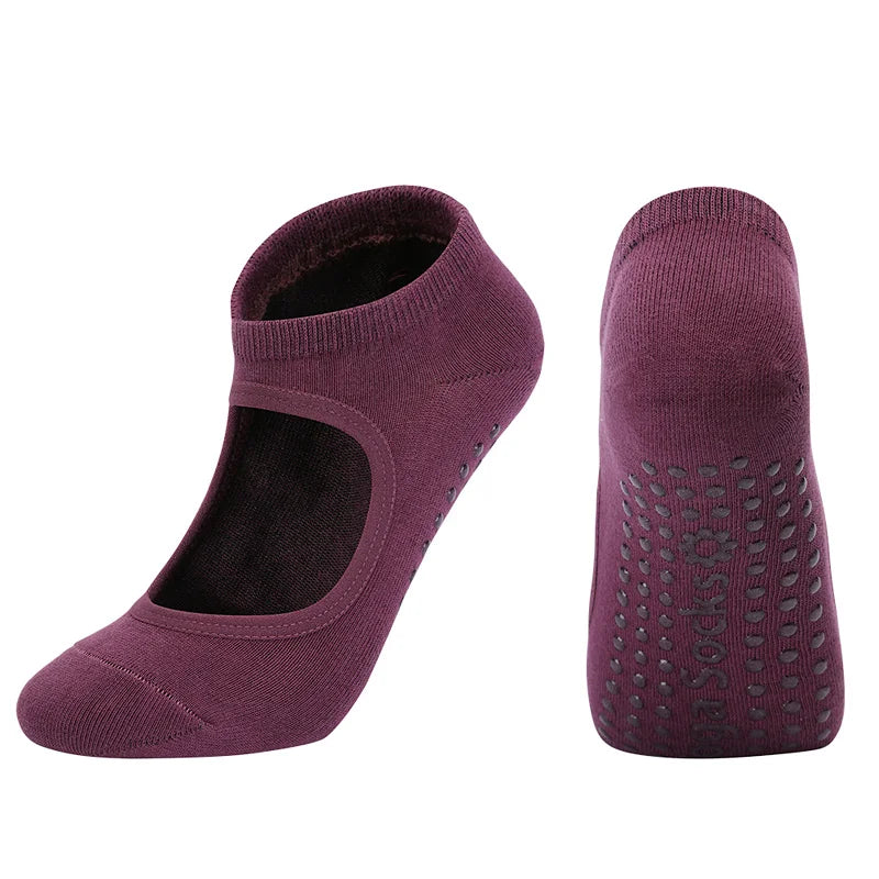 A pair of deep purple breathable women's Pilates and yoga socks shown from the side.