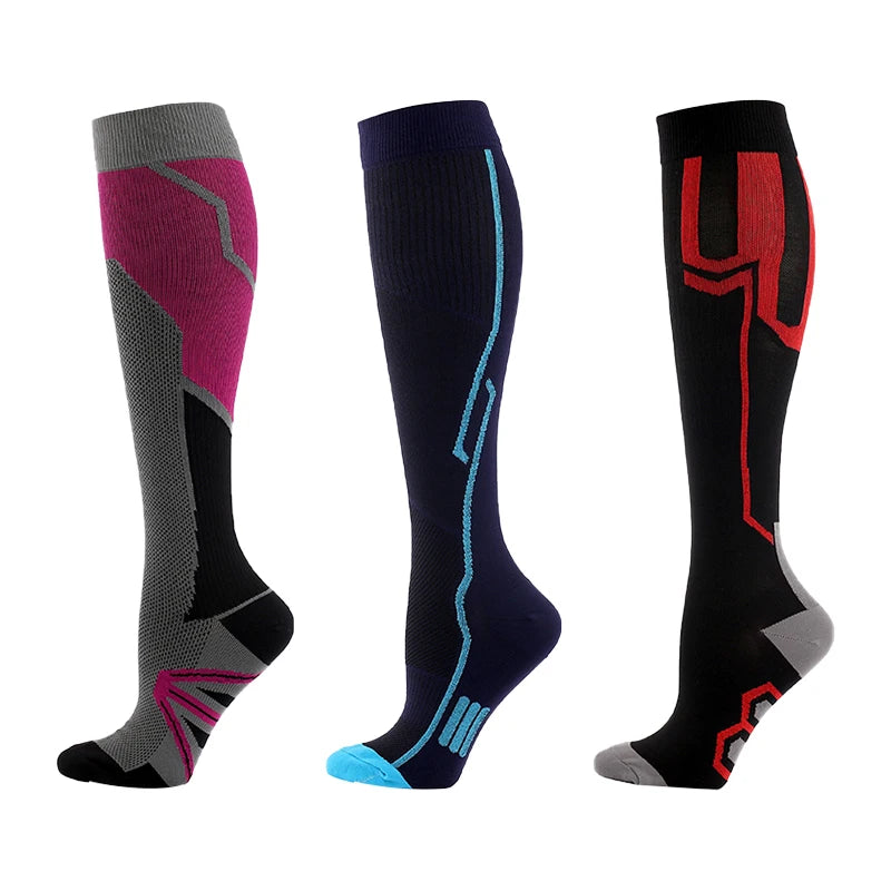 Three pairs of compression socks in shades of purple, black, and gray with neon accents.