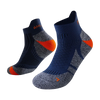 A pair of dark blue performance sports ankle socks with orange accents, shown from the side.