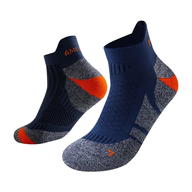 A pair of dark blue performance sports ankle socks with orange accents, shown from the side.