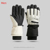 A pair of black and white thermal winter ski and riding gloves shown against a gray background.