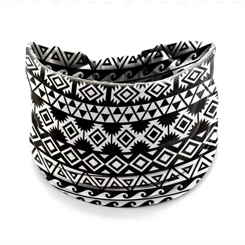 A black and white geometric patterned stretch cotton headband.