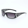Gafas negras con montura cuadrada y estampado floral blanco.
