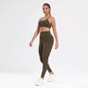 A woman models a leopard print seamless two-piece sports set consisting of a crop top and leggings.