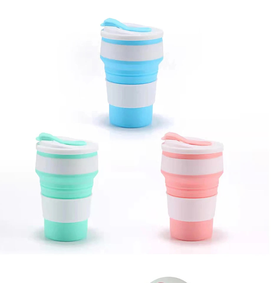 A set of reusable silicone collapsible coffee cups in various shades of blue and pink with lids.
