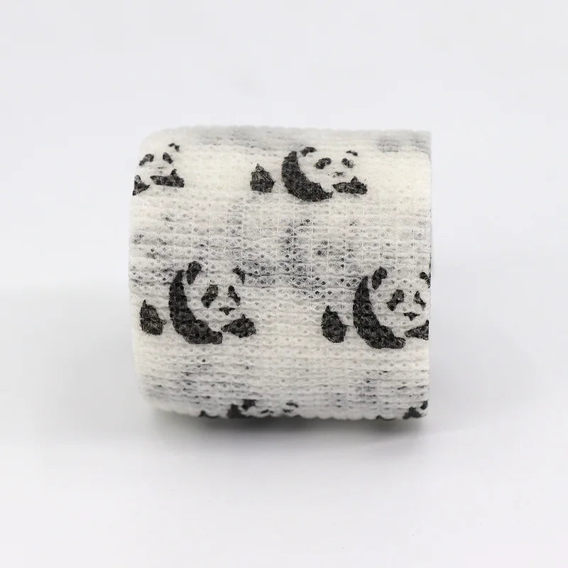 Roll of white elastic bandage tape with a repeating black fruit pattern