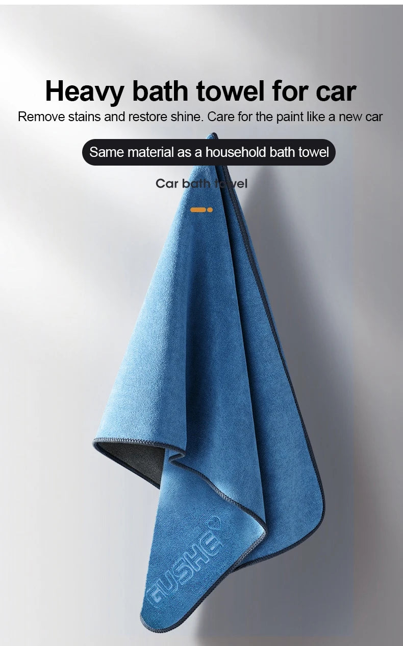 A folded blue bath towel used for cleaning car paint and removing stains.