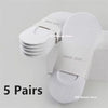 Five pairs of white invisible silicone no-show boat socks stacked on a white box.