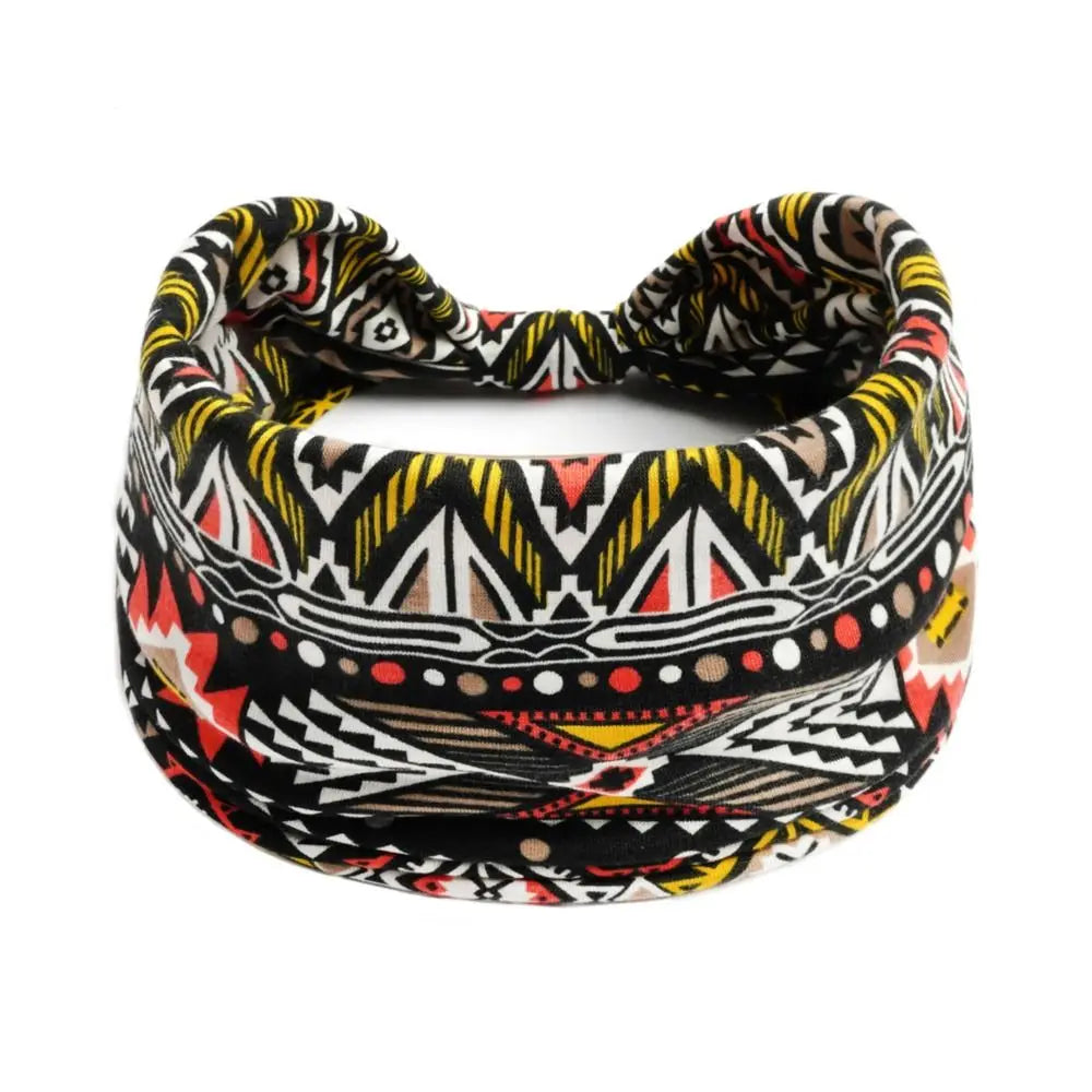 Bandeau pour cheveux bohème à motif géométrique noir, blanc et orange.