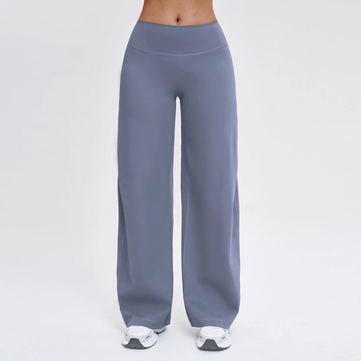 A person is wearing high-waist wide-leg yoga leggings in a solid gray color.