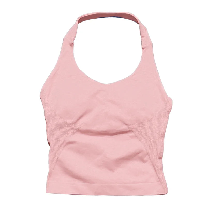 A light pink seamless performance yoga and gym tank top shown from the front.