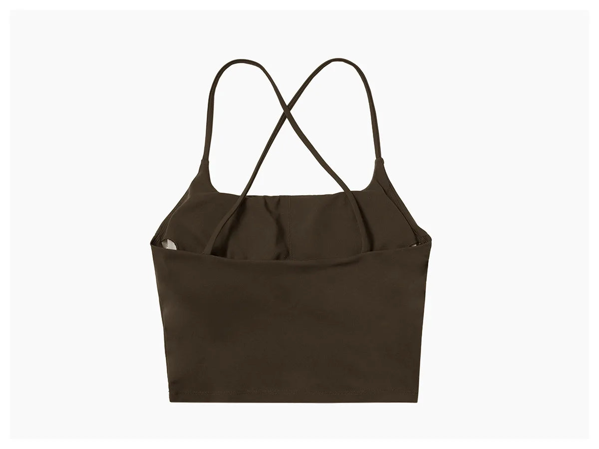 A dark brown women's performance tracksuit set top with criss-cross straps.