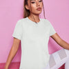 A woman models a white breathable summer yoga and fitness t-shirt in a studio setting.