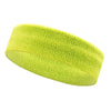 A bright lime green moisture-wicking athletic headband rolled into a cylinder.