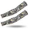A pair of tactical camouflage arm sleeves featuring a black and gold leaf pattern.