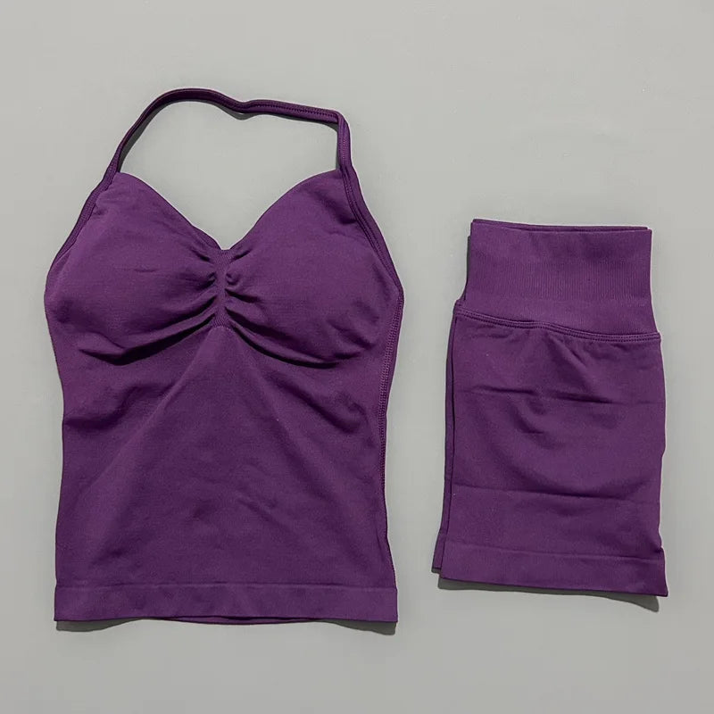 A purple women's seamless backless fitness set top and bottom shown against a light gray background.
